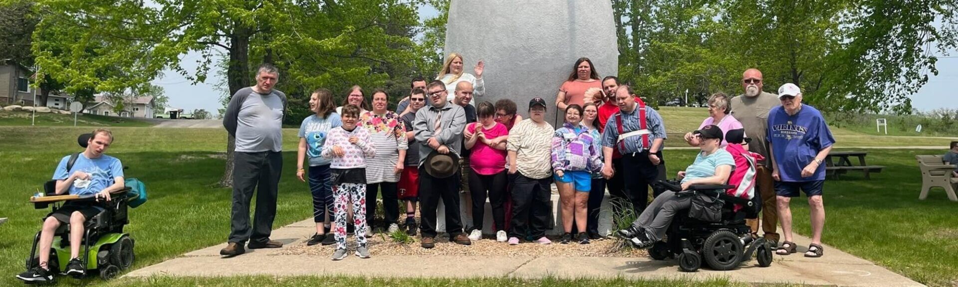 Group in front of statue