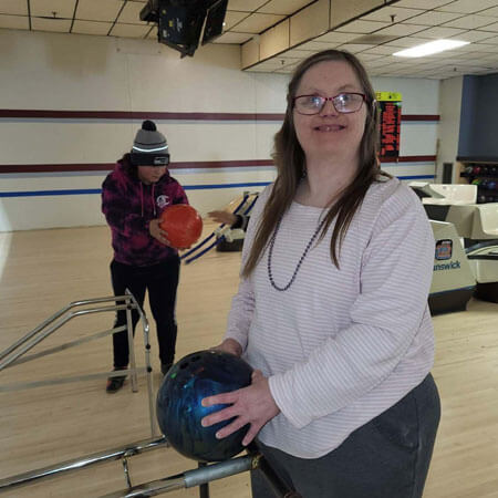 Woman in bowling alley